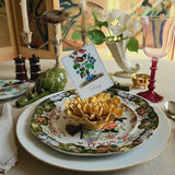 Decorative name place card with a bird illustration on a floral plate