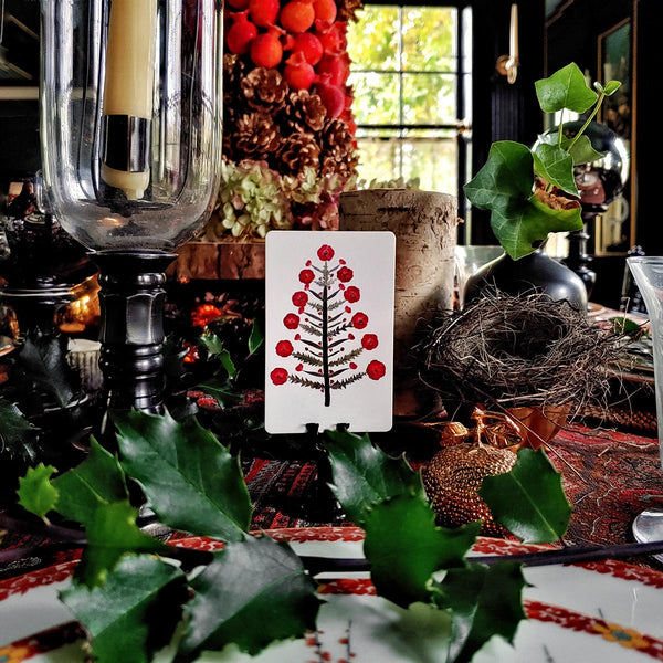 Marian Mcevoy (aka Gust the Poodle) for The Punctilious Mr. P's Place Card Co. 'Tanenbaum' custom place card on top of chinoiserie dinner plate set for christmas tablescape