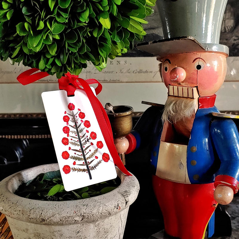 The Punctilious Mr. P's Place Card Co X Marian McEvoy holiday Custom  gift tags of christmas ornaments and a tannenbaum tree on a wooden toy soldier