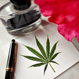 The Punctilious Mr. P's place card co. 'Cannabis' custom note card set on marble ledge with peony flower and fountain pen