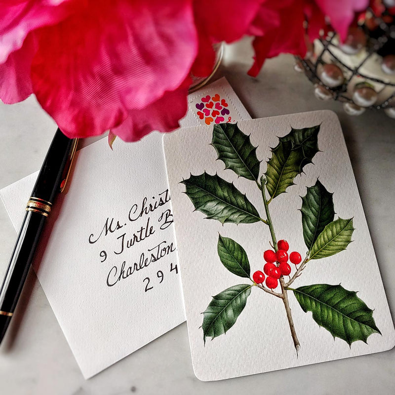 The Punctilious Mr. P's place card co. 'Holly' custom note card set on marble ledge with peony flower and fountain pen and addressed envelope