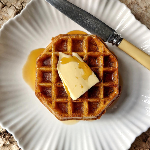 golden brown waffles drizzled with The Punctilious Mr. P's Pantry pure maple syrup