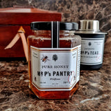 Mr. P's Pantry showing a jar of pure wildflower honey on emperador marble with tea caddy and Mr. P's tea canister in background