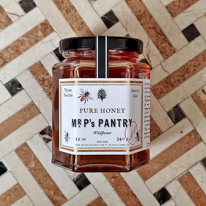 Mr. P's Pantry showing a jar of pure wildflower honey on tile floor