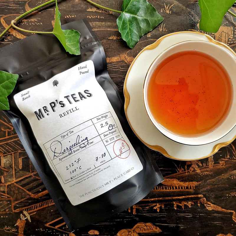 The Punctilious Mr. P's Darjeeling black Tea refill pouch with tea cup and saucer
