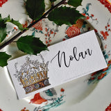 The Punctilious Mr. P's Place Card Co. 'Coronet Nouveau' laydown custom place card on top of chinoiserie dinner plate