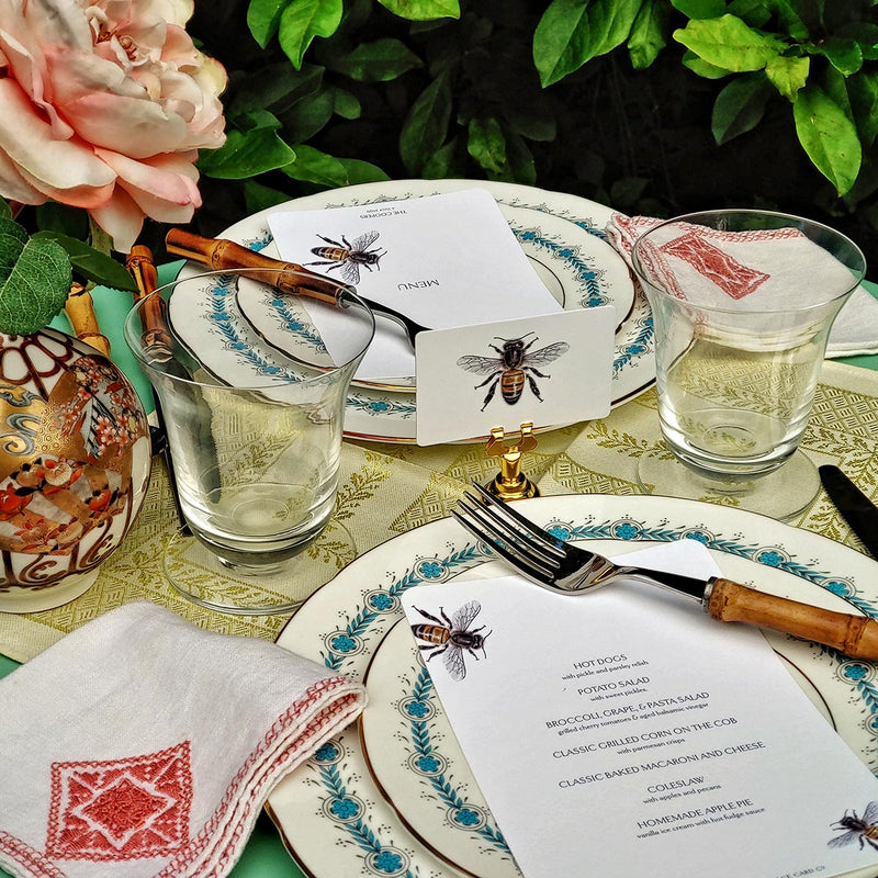 The Punctilious Mr. P's Place Card Co. 'Bees' custom place cards on a beautiful spring table set with menu cards and chic bamboo cutlery