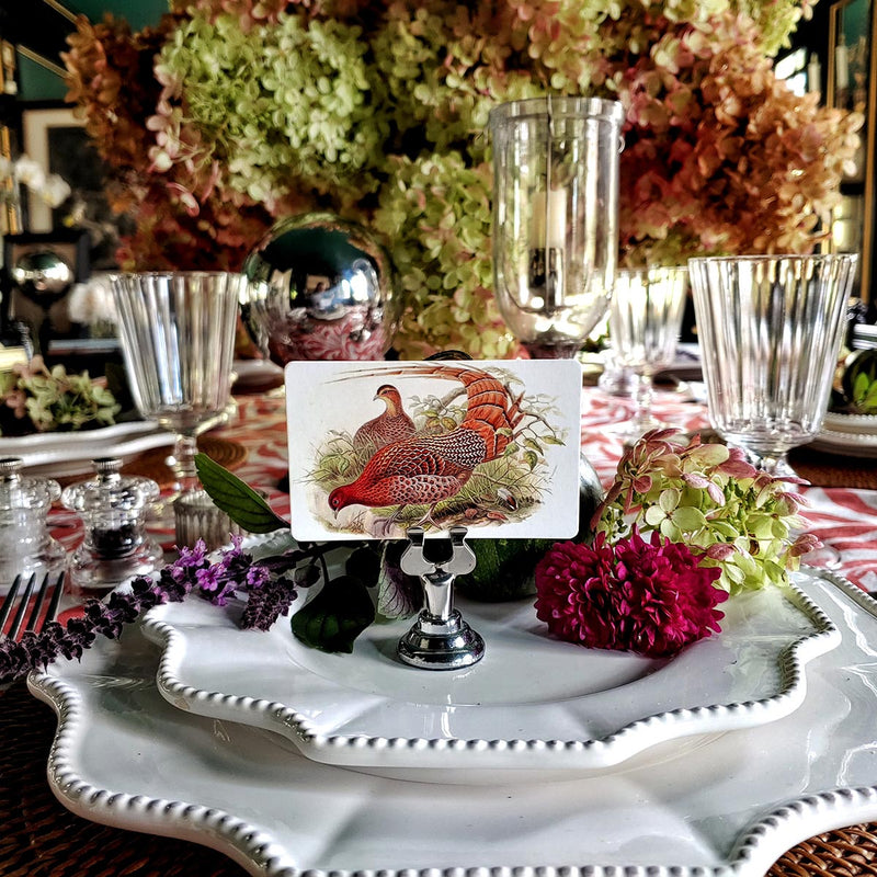 The Punctilious Mr. P's Place Card Co. 'Fiery Pheasants' custom place card set on an autumn tablescape with dried hydrangea and beautiful white china 