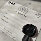 detail of The Punctilious Mr. P's $100 Boxed Gift Certificate with wax seal and grosgrain ribbon whose design is inspired by vintage money