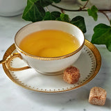 The Punctilious Mr. P's Place Card Co. Jasmine flavored green Tea in a fine tea cup and saucer