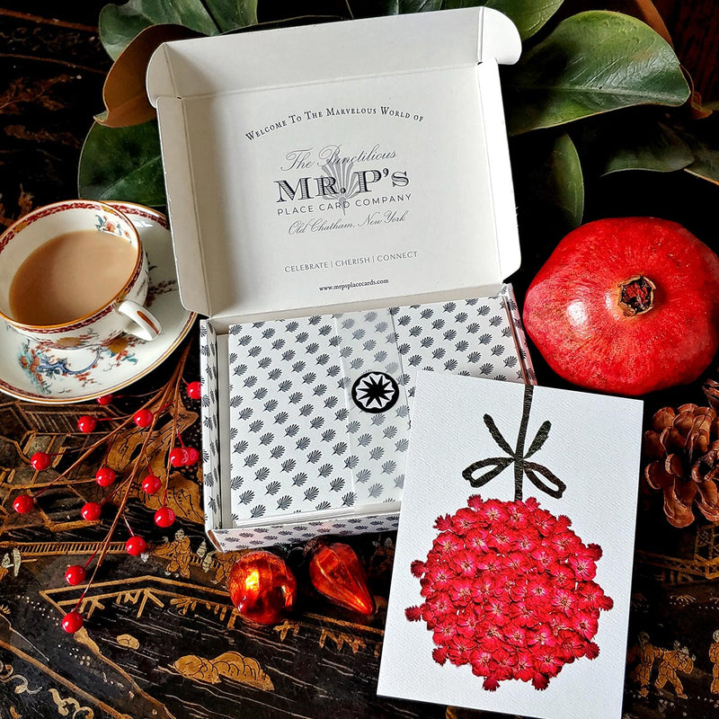 The punctilious mr. P's place card co. collaboration with Marian McEvoy (aka Gust the poodle) anthemion pattern holiday packaging with mr. p's crest on inside box flap