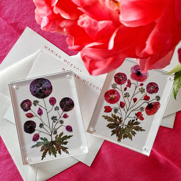 Marian McEvoy x The Punctilious Mr. P's Place Card Co collab with red and purple pressed poppy botanical motif magnetic acrylic paperweights