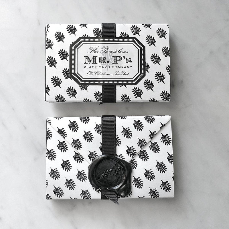 A front and back view of a pack of Mr. P's Place Cards