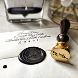 The Punctilious Mr. P's Place Card Co. custom wax seal, ink bottle and beautiful vase of peony flowers
