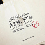 The Punctilious Mr. P's Everyday natural colored canvas tote bag showing detailed view of Mr. P's logo and website address